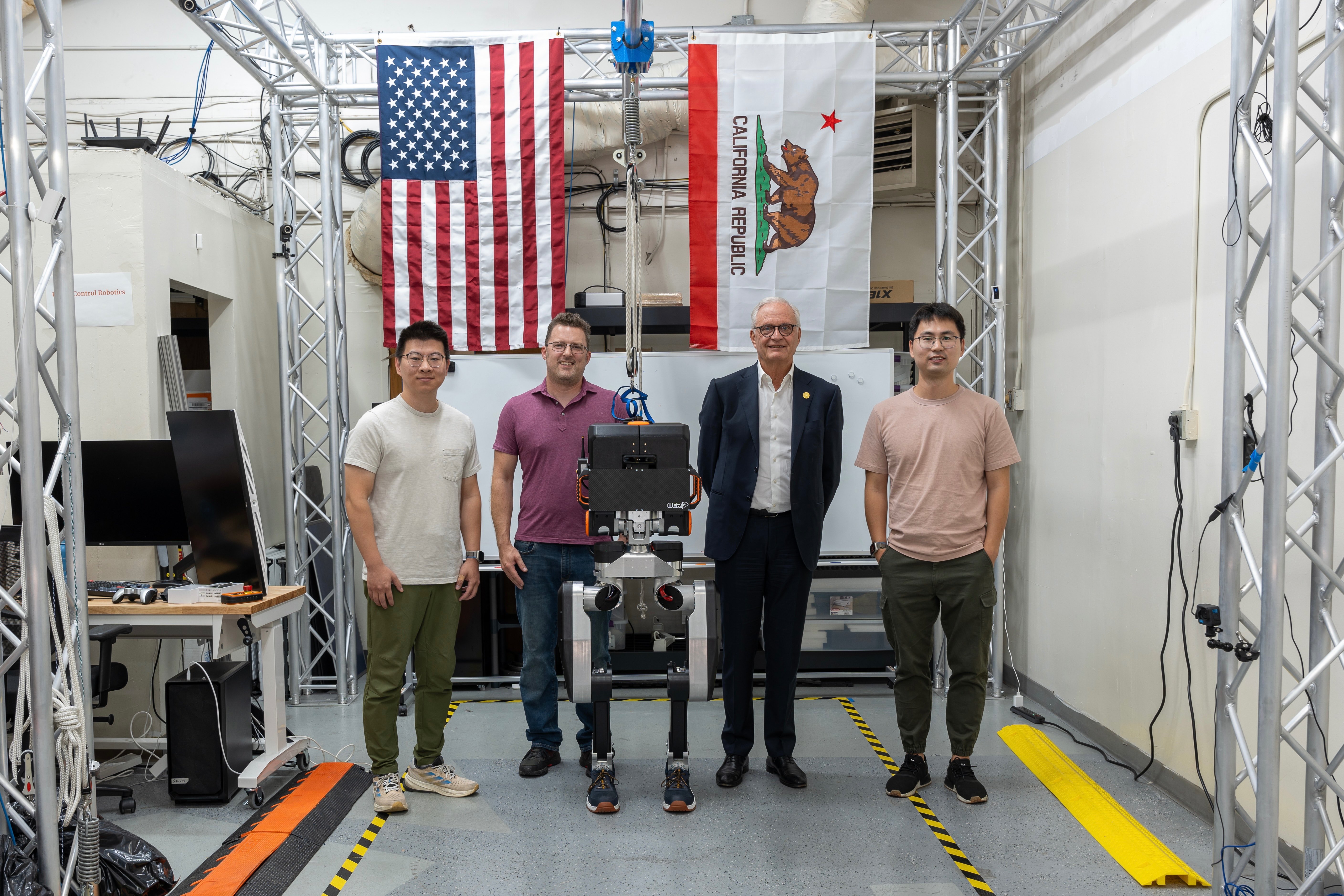 Executive visit to UCR lab with humanoid robot